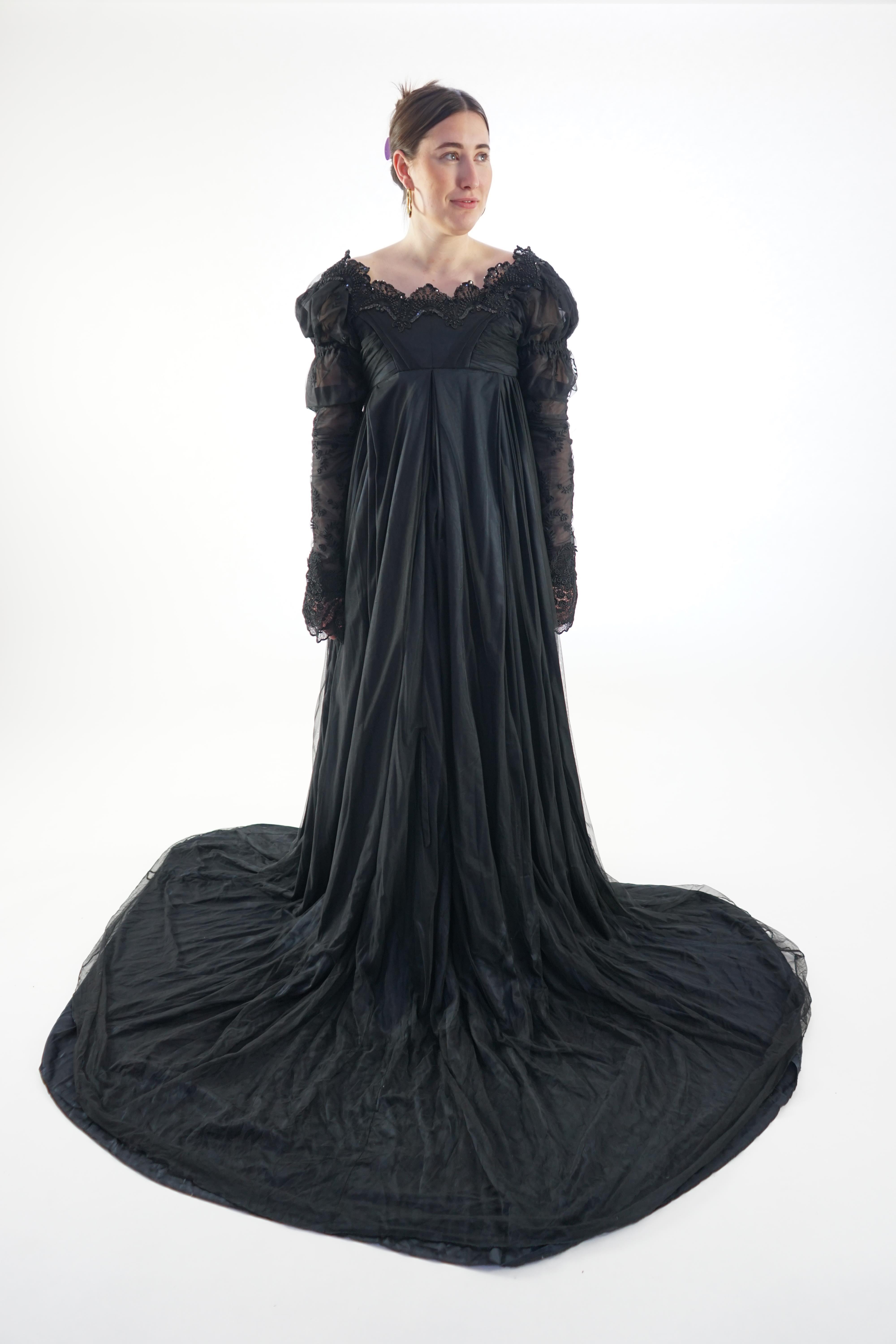 A fine quality lady's black satin, chiffon and jet trimmed Regency style evening dress with long train, lacing on jet stomacher. Ex English National Opera (unlabelled) 'Don Giovanni'